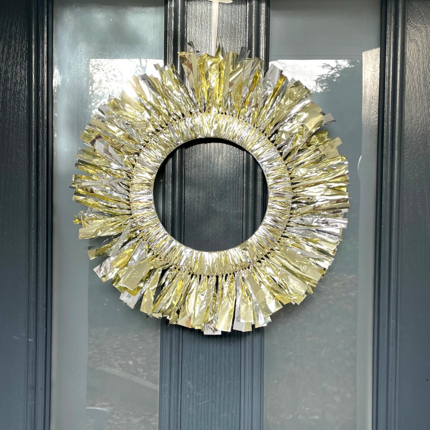 Decorative gold wreath on a glass door