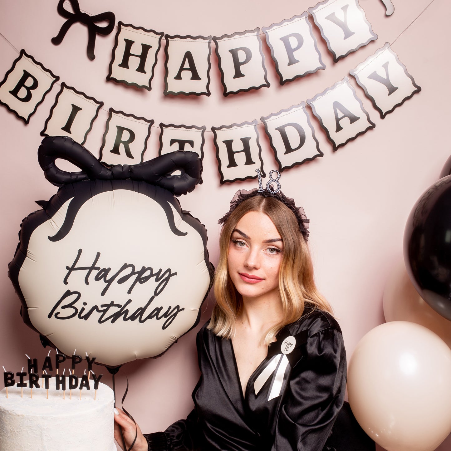 Minimal Happy Birthday banner in cream and black with bow details. Perfect for modern, stylish birthday decorations.