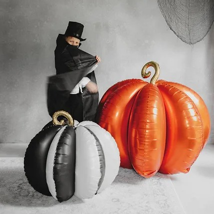 Giant Foil pumpkin Balloons in orange, black, and white.