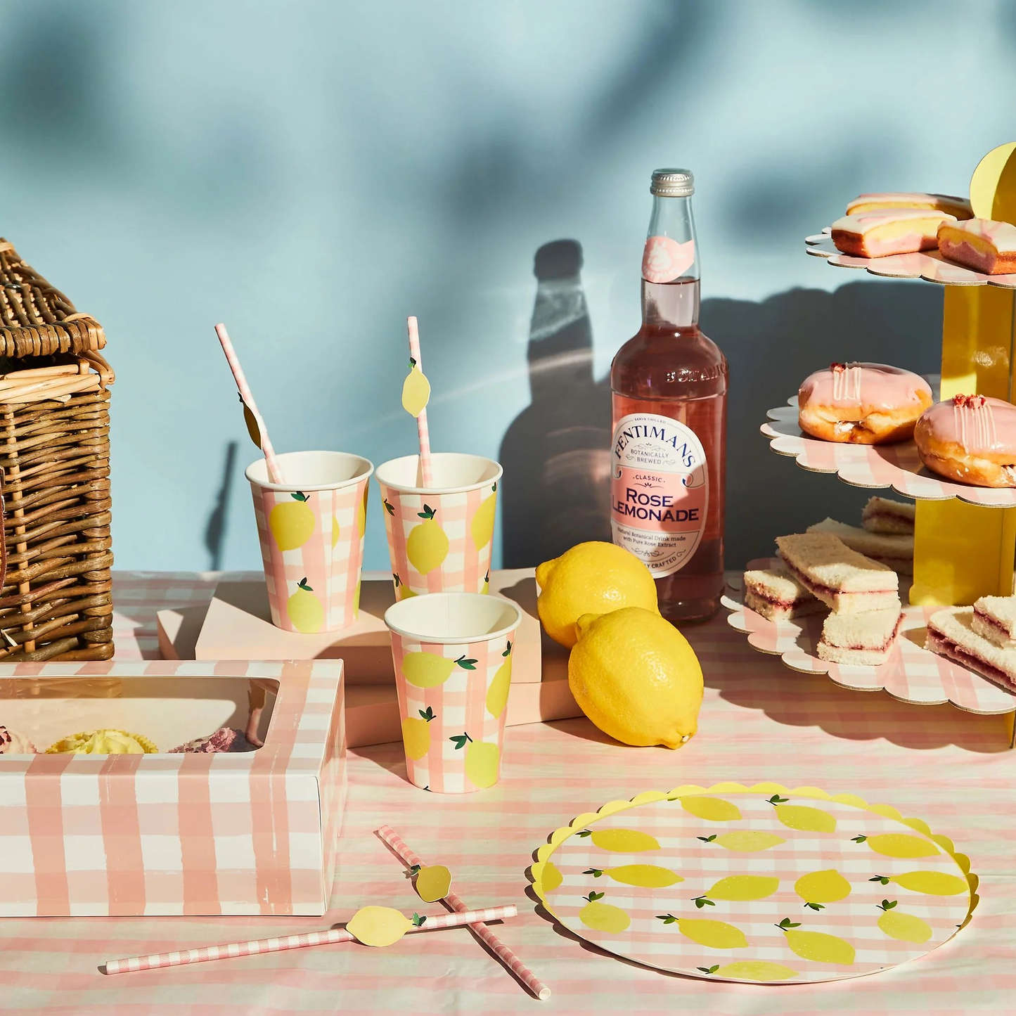 Lemon and pink gingham paper plates with scalloped edge