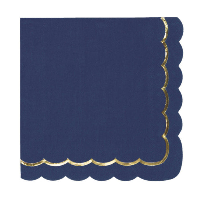 Navy blue napkin with gold scalloped edge on a white background