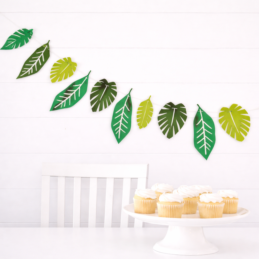 Green safari leaves garland with tropical leaf shapes for jungle themed parties