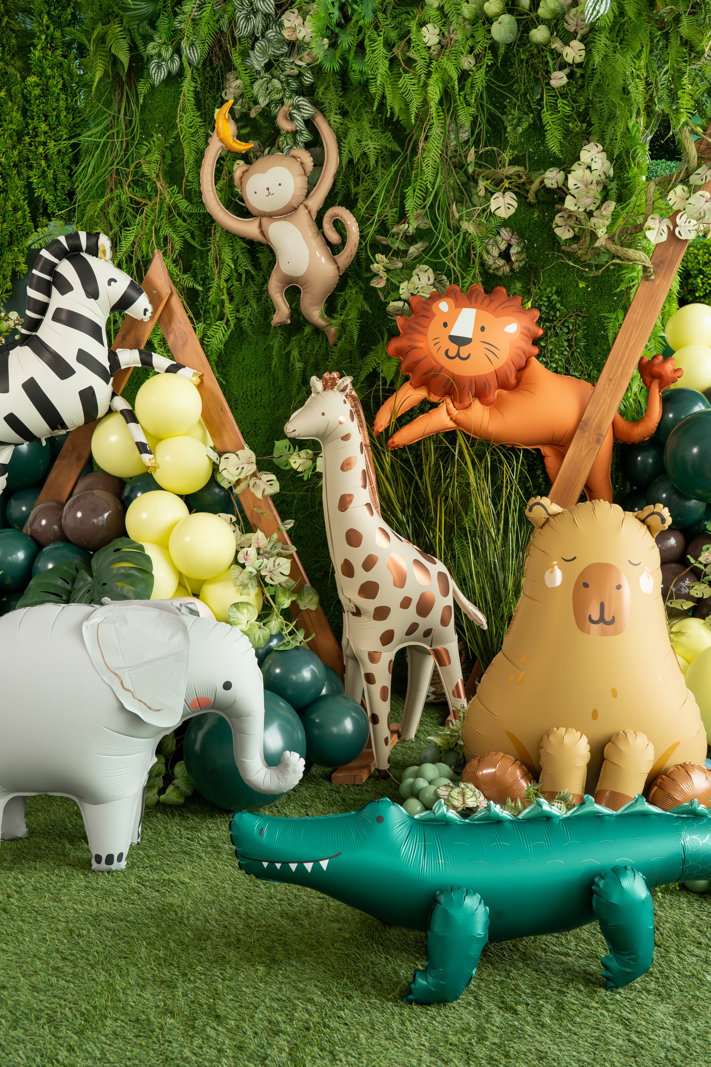 Standing elephant foil balloon with pink cheeks and grey body for jungle themed parties