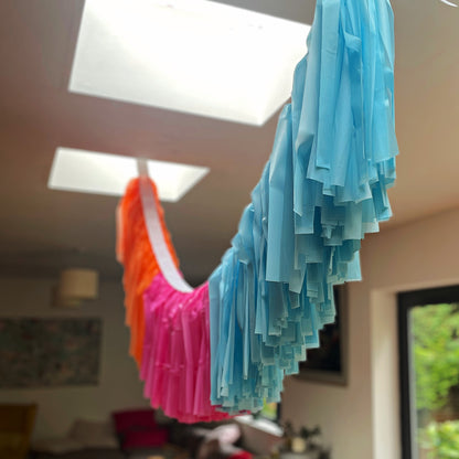 fringe decorations hanging from ceiling