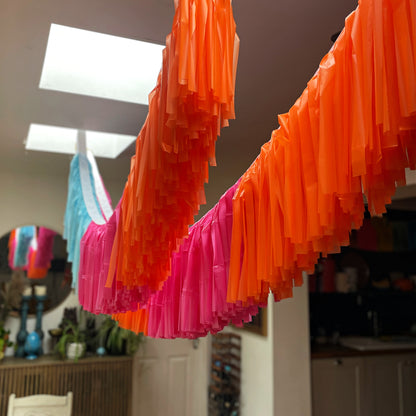 Colourful fringe decorations hanging from ceiling