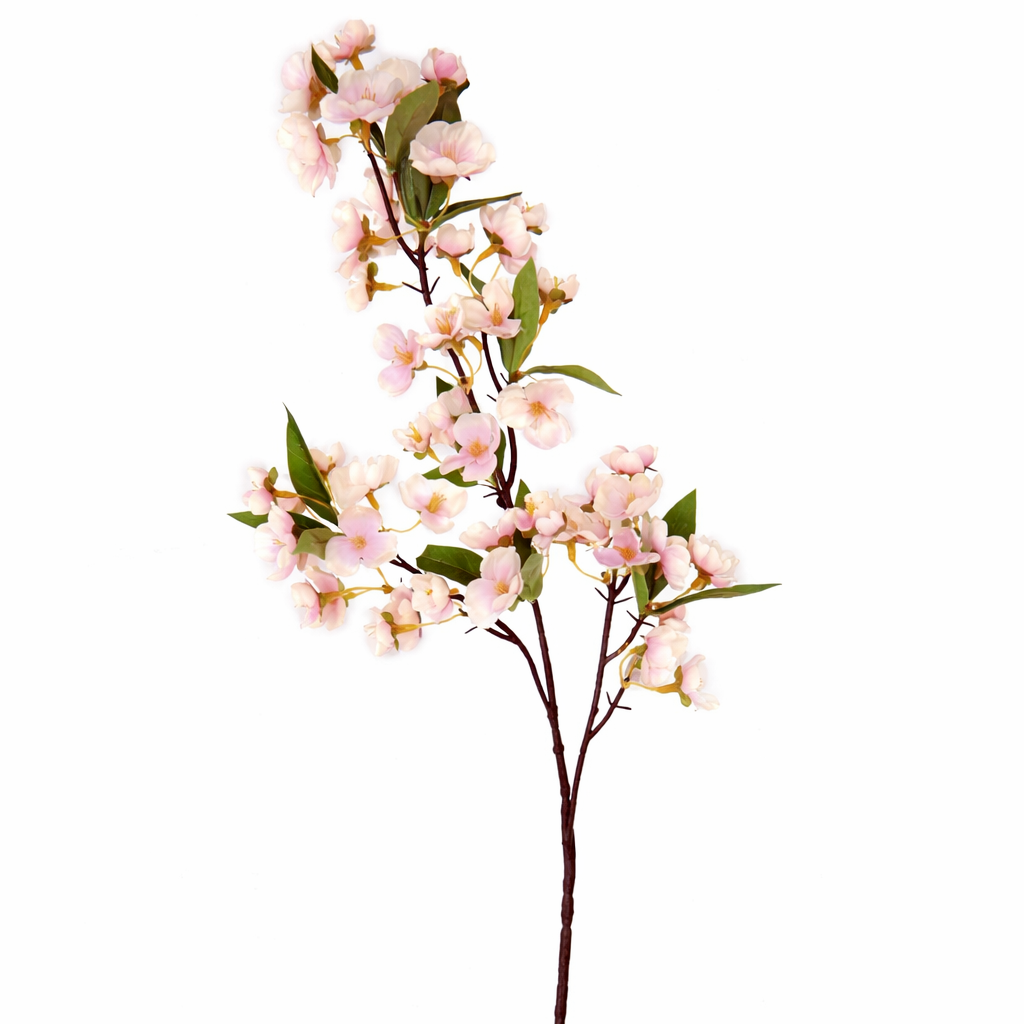 Artificial cherry blossom branch with pink flowers on a white background