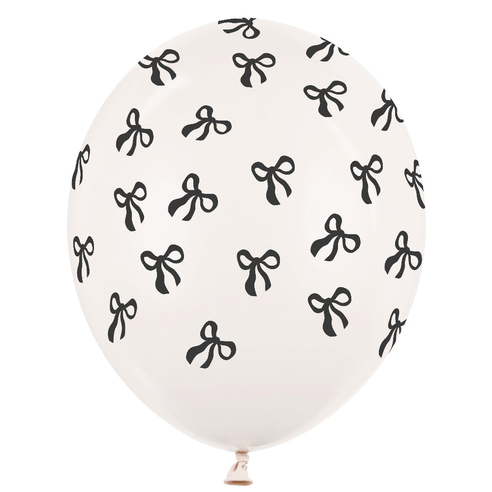White balloon with black bow pattern on a white background