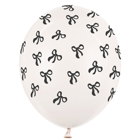 White balloon with black bow pattern on a white background