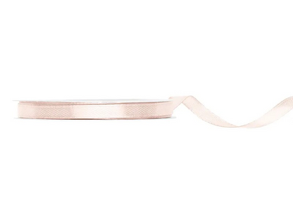 Blush satin ribbon on a white background