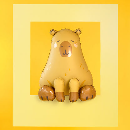 Capybara shaped foil balloon in beige and brown sitting upright