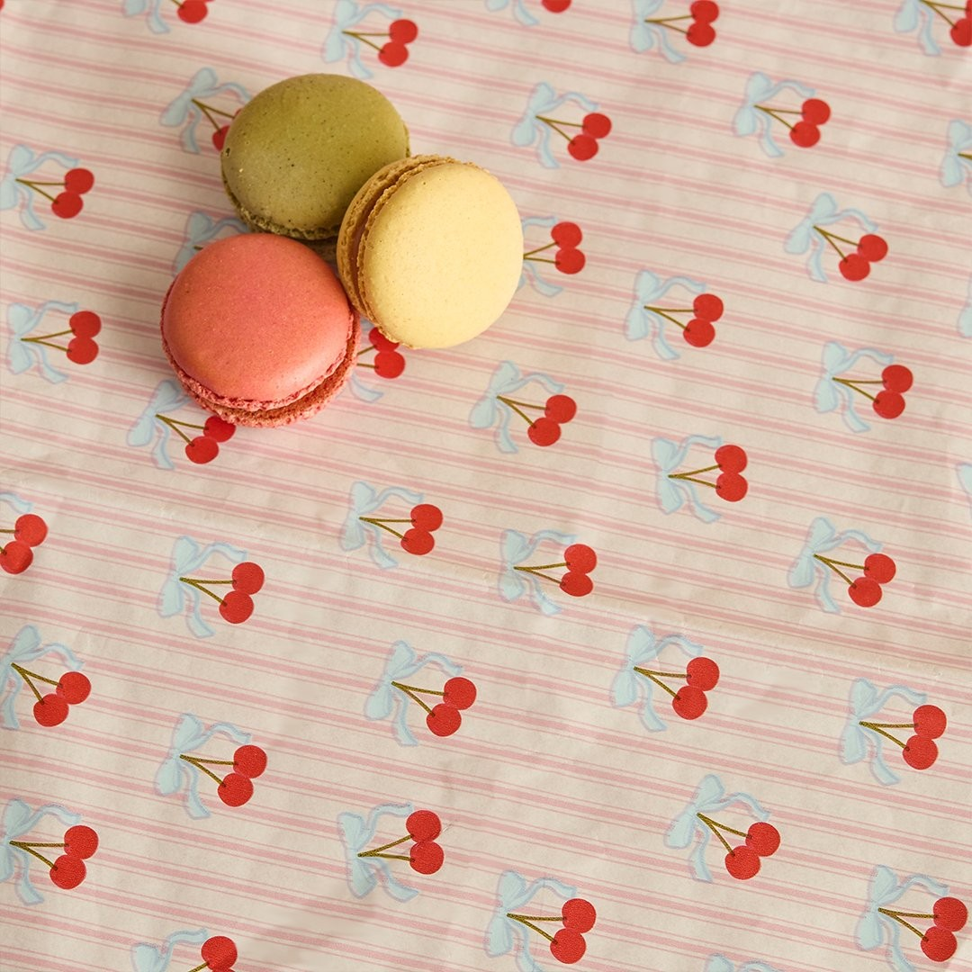 Cherry print paper tablecloth with pink stripe background