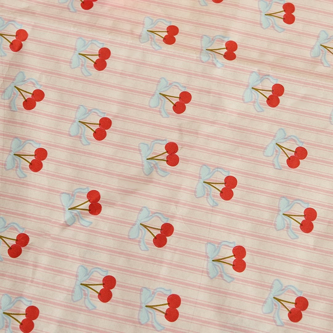 Cherry print paper tablecloth with pink stripe background