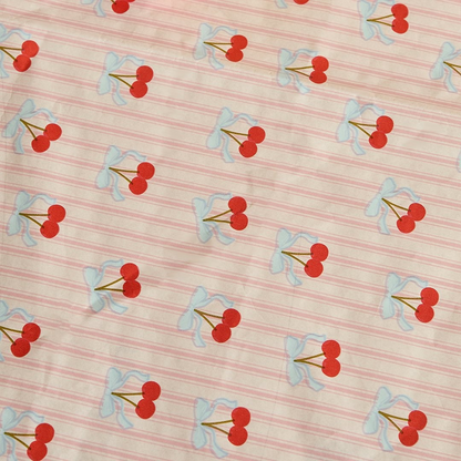 Cherry print paper tablecloth with pink stripe background