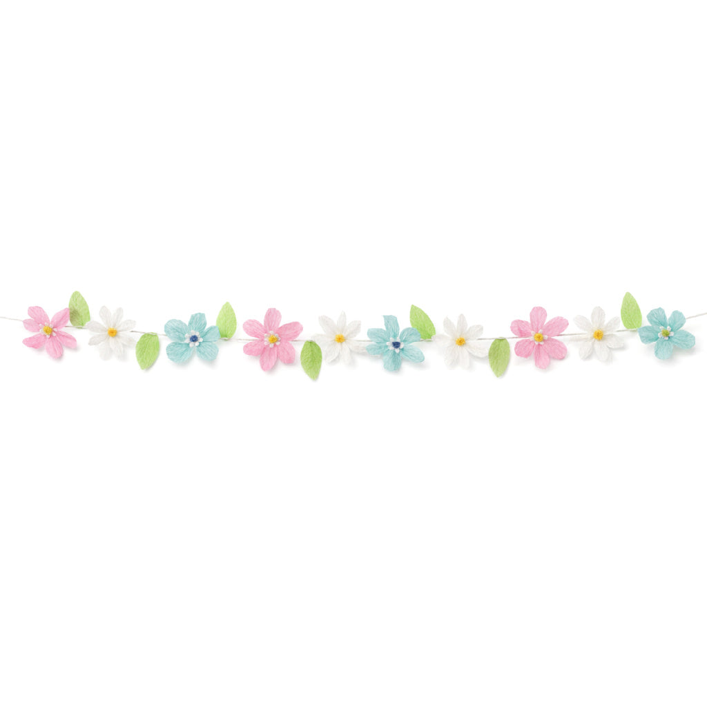 Pastel crepe paper flower garland with pink, white and turquoise flowers and green leaves on a white string, spring and Easter party decoration.