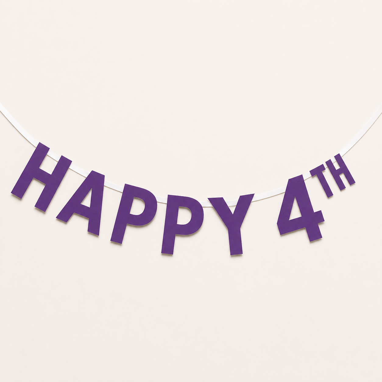 Purple 'HAPPY 4TH' letter banner garland hanging on a thin white string against a plain off-white background.