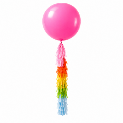 A custom Made balloon tassel fringe with block colors hanging from a white balloon, featuring orange, yellow, and green colors.