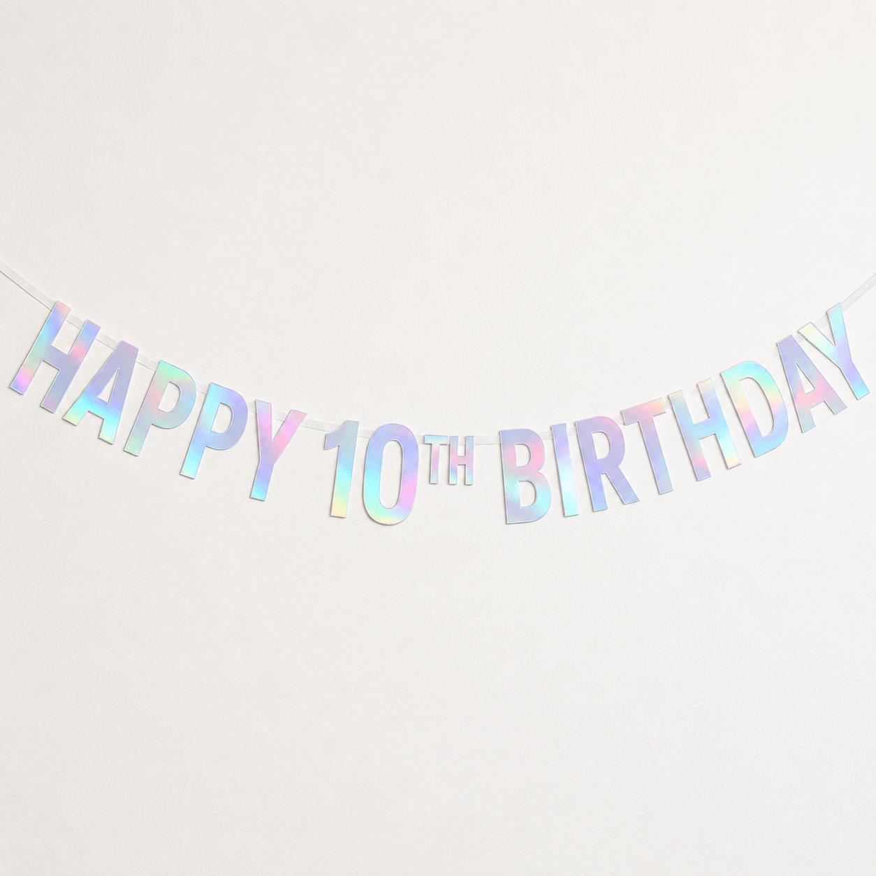 Rainbow Iridescent 'HAPPY 10TH BIRTHDAY' banner garland on a plain white background.