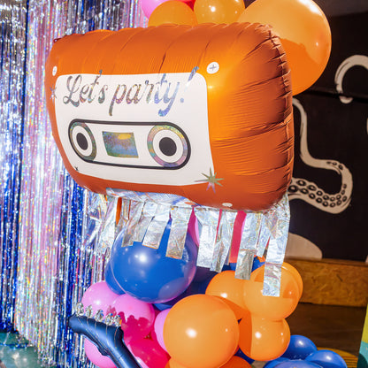 Giant orange cassette tape foil balloon with silver fringe