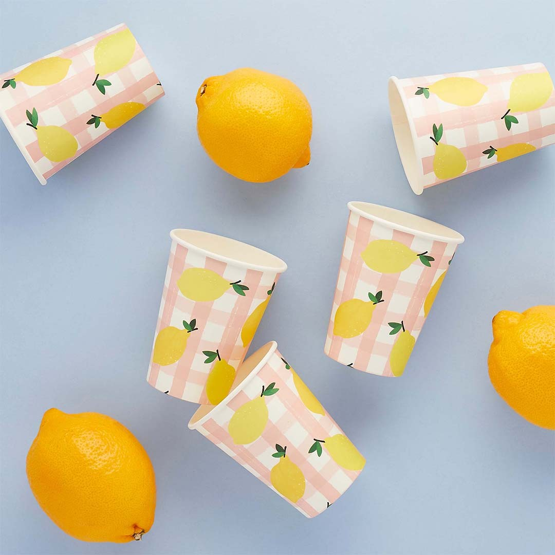 Lemon and pink gingham paper cups for summer party table