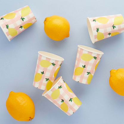 Lemon and pink gingham paper cups for summer party table