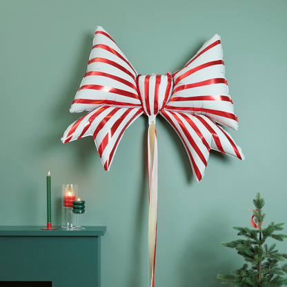 Red and white striped foil balloon in bow shape for Christmas Parties