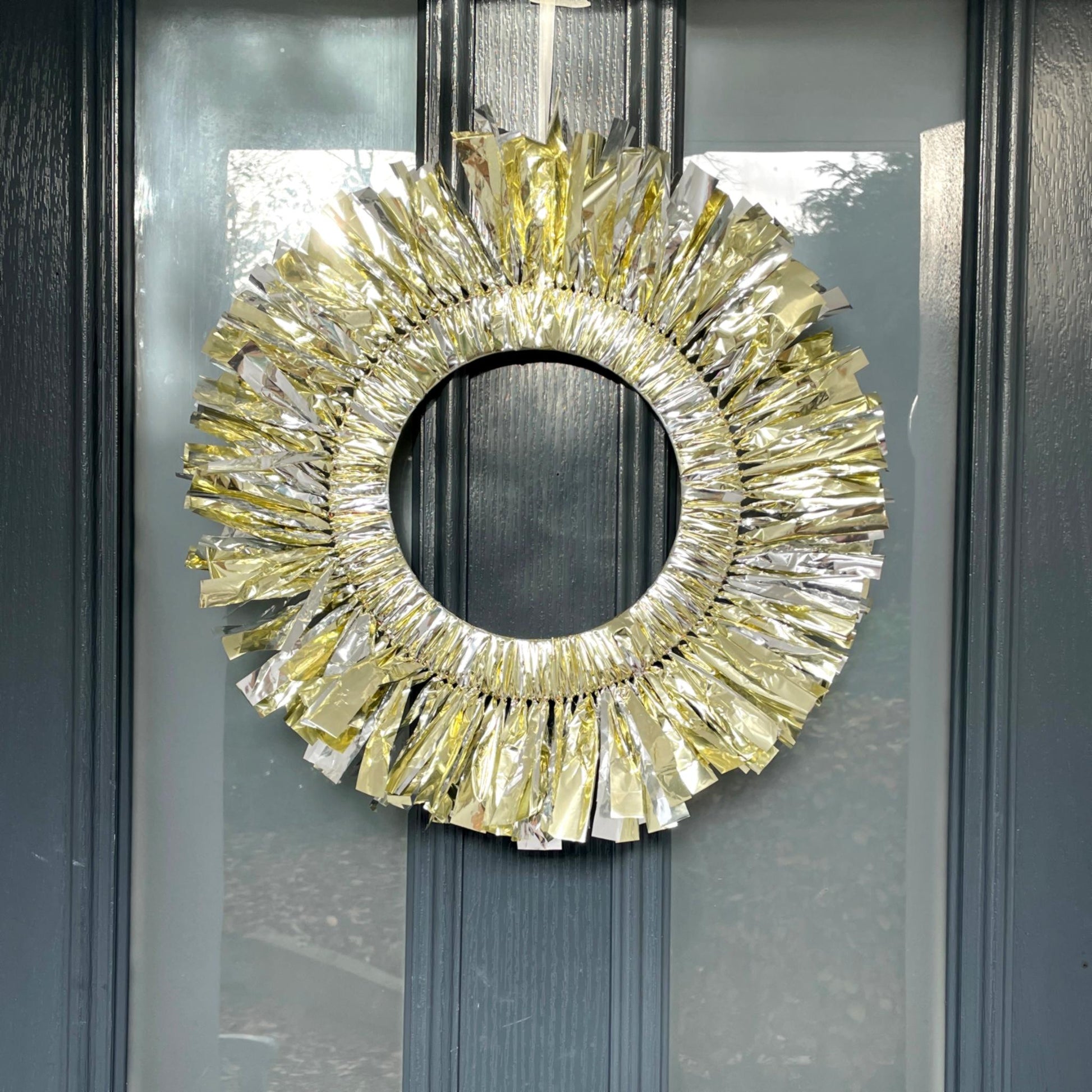 Decorative gold wreath on a glass door
