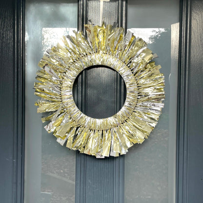 Decorative gold wreath on a glass door