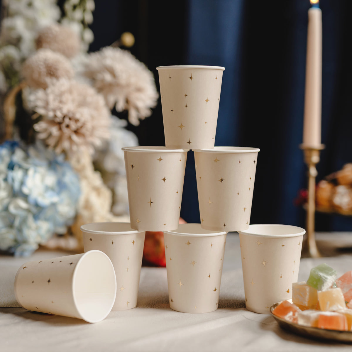 Cream paper party cups with delicate metallic gold stars