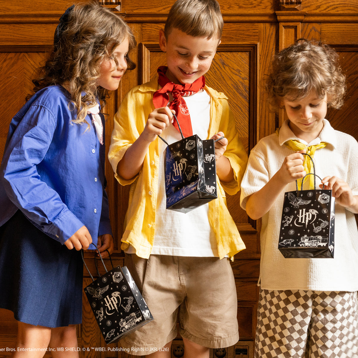 Black Harry Potter party bag with handles and magical Hogwarts illustrations