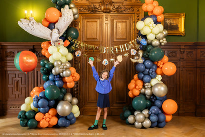 Harry Potter birthday party with Hedwig balloon and balloon garland