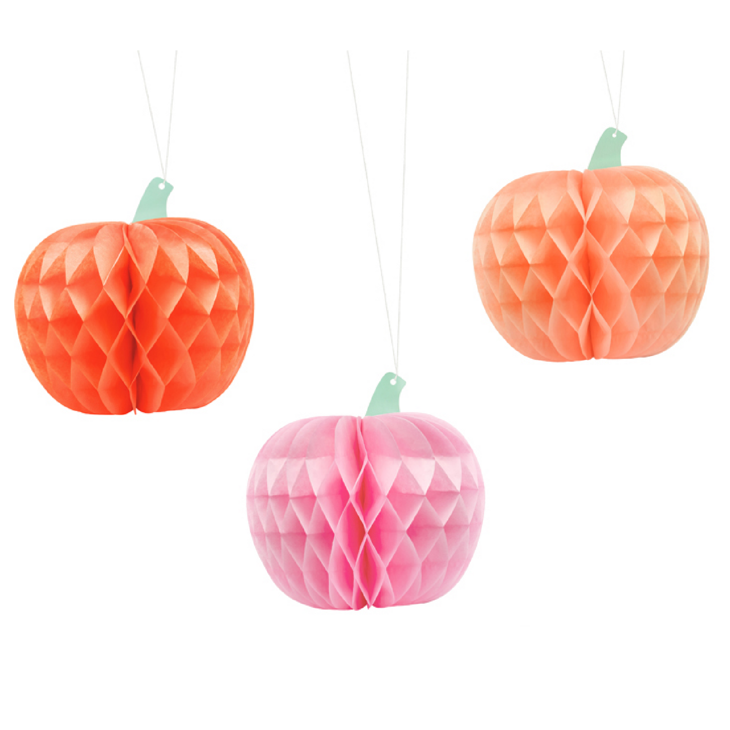 Three honeycomb paper pumpkins in orange, pink, and red on a white background