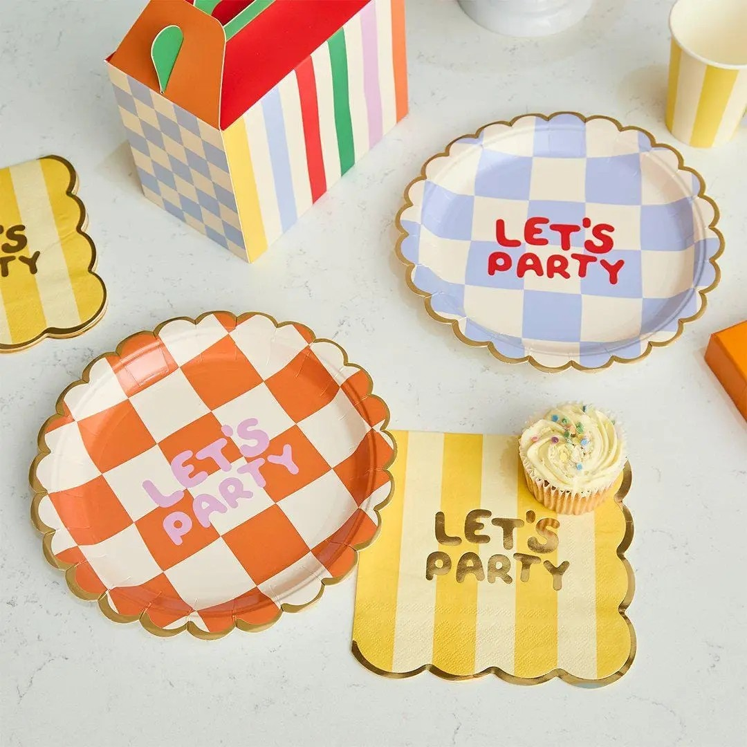 Whimsical Let’s Party paper plates with orange and lilac checkerboard designs