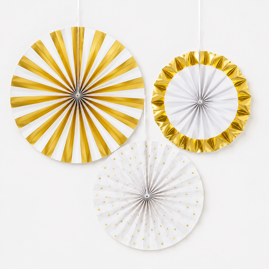 Three round hanging paper party decorations in white and metallic gold, including a striped fan, a ruffled ring, and a polka-dot fan, shown against a plain white background.