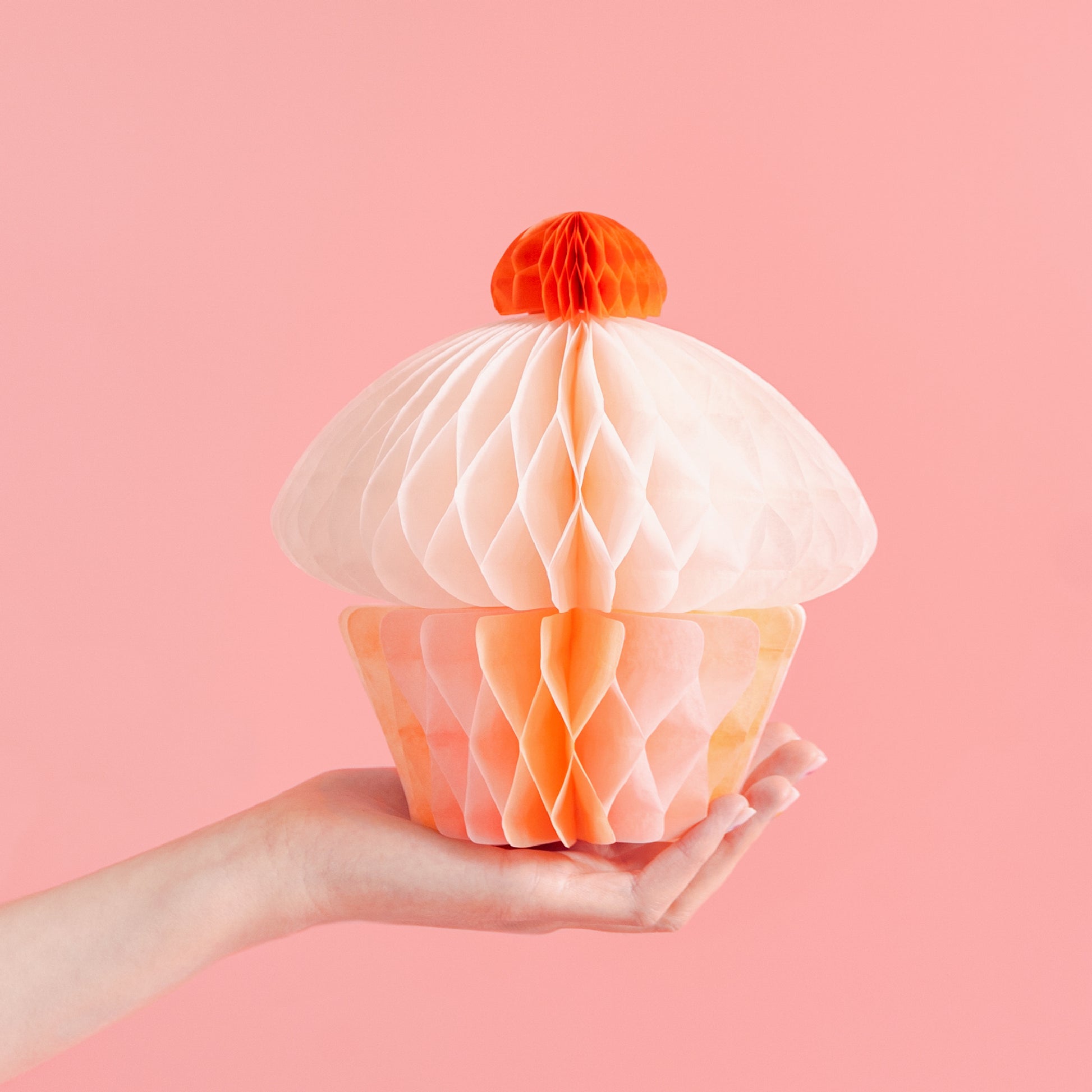 Pastel honeycomb paper cupcake decoration with hanging ribbon for party decor