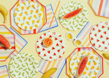 A summer picnic party setup with summer themed tableware and party supplies