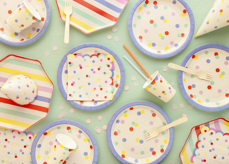 A summer picnic party setup with summer themed tableware and party supplies