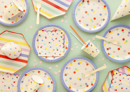 A summer picnic party setup with summer themed tableware and party supplies