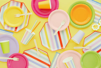 Summer Themed paper plates, cups, and utensils on a yellow background