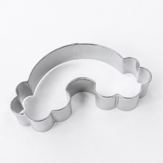 A silver metal rainbow-shaped cookie cutter on a plain white background.