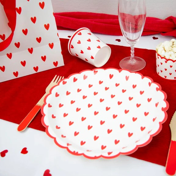 Paper plates with red hearts and red scalloped edge