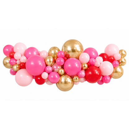 Balloon arch with pink, gold, and red balloons on a white background