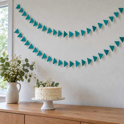 Teal Triangle Party Garlands above a Birthday Cake