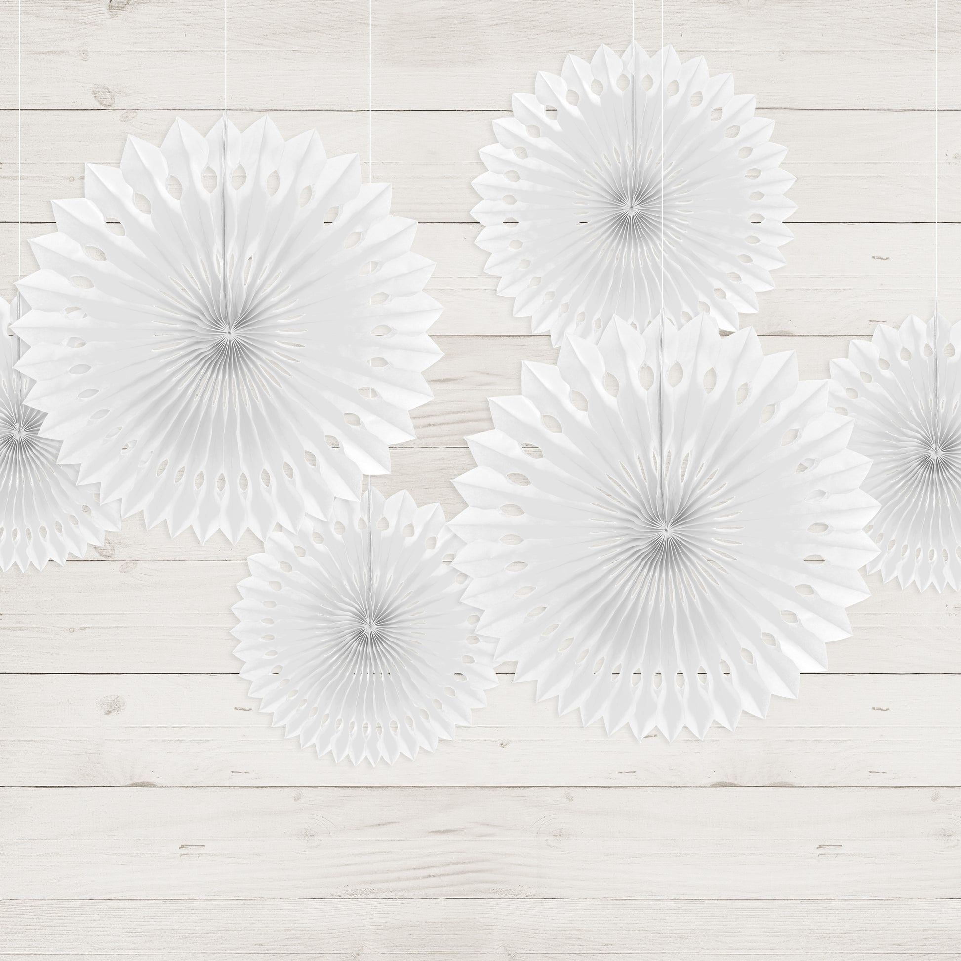 Set of three white paper fans. 