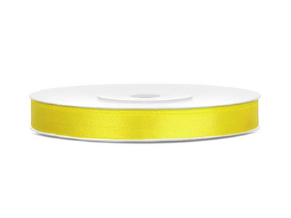 Roll of yellow ribbon on a white background