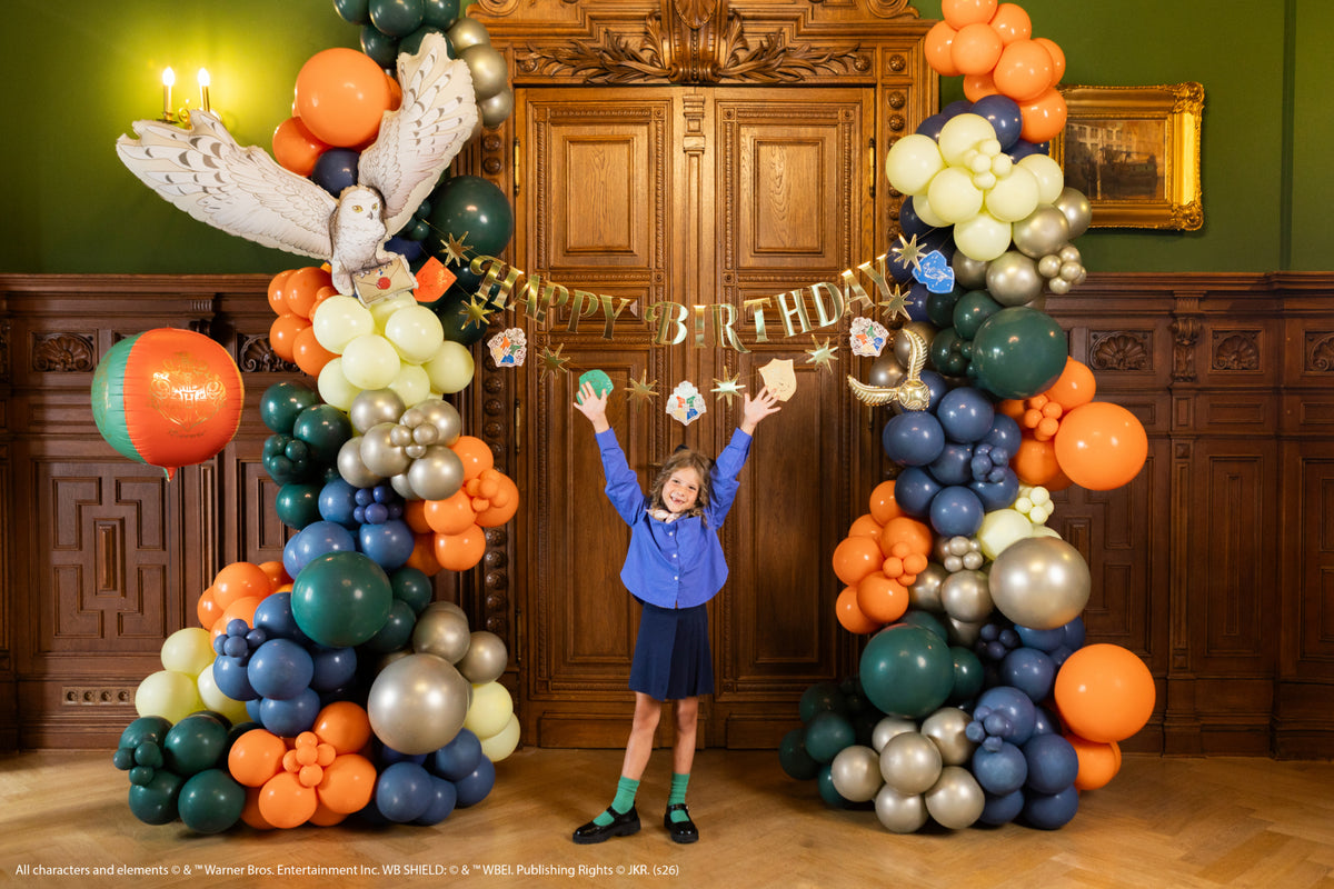 Harry Potter Happy Birthday banner displayed with balloon garland