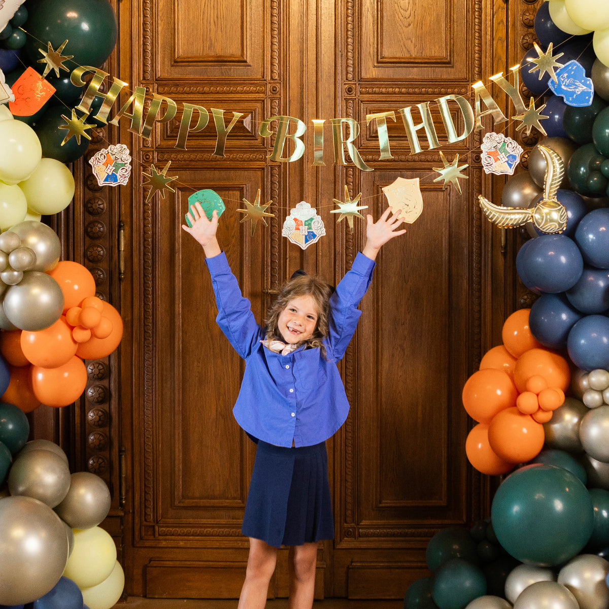 Harry Potter Happy Birthday banner displayed with balloon garland